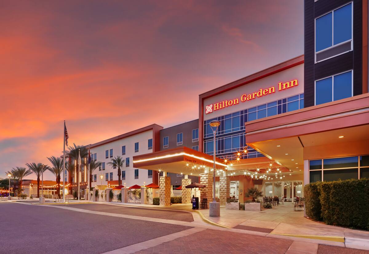 Hilton Garden Inn Chandler Downtown exterior at sunset