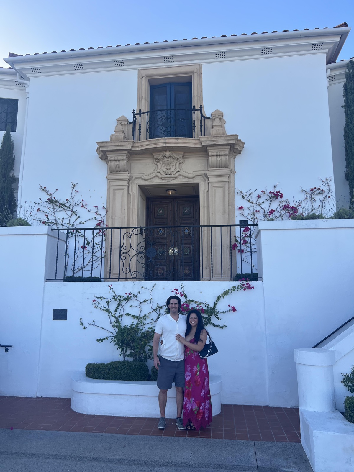 Evan and Joselyn in front of a villa